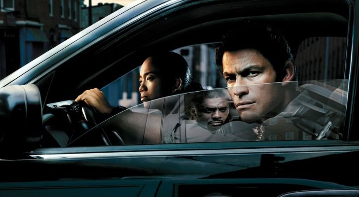 Characters from The Wire series in a car
