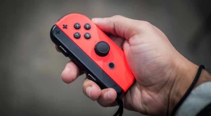 A red and black joy-con controller
