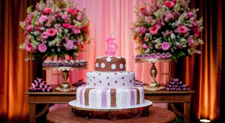 A girls 15th birthday party with a big birthday cake