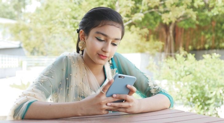 A Pakistani woman on her phone
